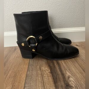 Stuart Weitzman black leather moto boots with gold hardware